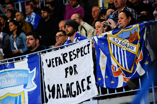 MALAGA, SPAGNA - 22 DICEMBRE: I tifosi del Malaga allo stadio. (Photo by David Ramos/Getty Images) Il Malaga festeggia la storica promozione con 122 tatuaggi a tema regalati ai tifosi- immagine 2
