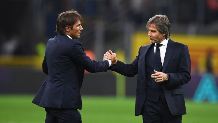 MILAN, ITALY - SEPTEMBER 14: Head coach Antonio Conte and team technical manager Gabriele Oriali of FC Internazionale celebrate the win at the end of the Serie A match between FC Internazionale and Udinese Calcio at Stadio Giuseppe Meazza on September 14, 2019 in Milan, Italy. (Photo by Claudio Villa - Inter/FC Internazionale via Getty Images) conte oriali