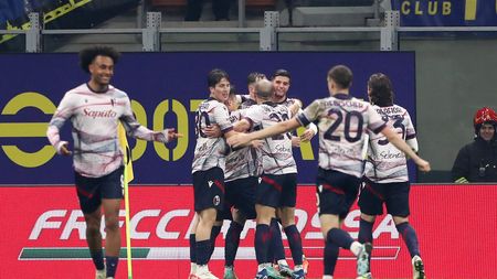 MILAN, ITALY - DECEMBER 20: Sam Beukema of Bologna FC (obscured) celebrates with teammates after scoring their team's first goal during the Coppa Italia Round of 16 match between FC Internazionale and Bologna FC at Giuseppe Meazza Stadium on December 20, 2023 in Milan, Italy. (Photo by Marco Luzzani/Getty Images)