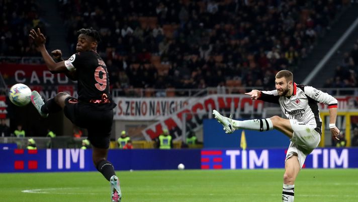 MILAN, ITALY - MARCH 21: Strahinja Pavlovic of AC Milan scores his team's first goal under pressure from Duvan Zapata of Torino during the Serie A match between AC Milan and Torino FC at Giuseppe Meazza Stadium on March 21, 2026 in Milan, Italy. (Photo by Marco Luzzani/Getty Images) pavlovic