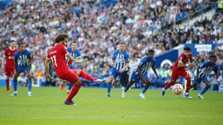 BRIGHTON, ENGLAND - OCTOBER 08: Mohamed Salah of Liverpool scores the team's second goal from a penalty during the Premier League match between Brighton & Hove Albion and Liverpool FC at American Express Community Stadium on October 08, 2023 in Brighton, England. (Photo by Steve Bardens/Getty Images)