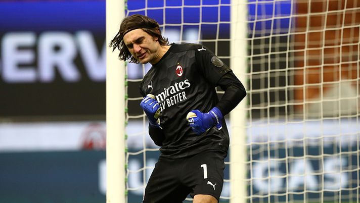 MILAN, ITALY - JANUARY 12: Ciprian Tatarusanu of A.C. Milan celebrates after saving the penalty of Tomas Rincon of Torino F.C. during a penalty shoot out during the Coppa Italia match between AC Milan and Torino FC at Stadio Giuseppe Meazza on January 12, 2021 in Milan, Italy. Sporting stadiums around Italy remain under strict restrictions due to the Coronavirus Pandemic as Government social distancing laws prohibit fans inside venues resulting in games being played behind closed doors. (Photo by Marco Luzzani/Getty Images) Coppa Italia, il Milan e i rigori: ultimi 35 anni, 4 qualificazioni e 1 eliminazione - immagine 1