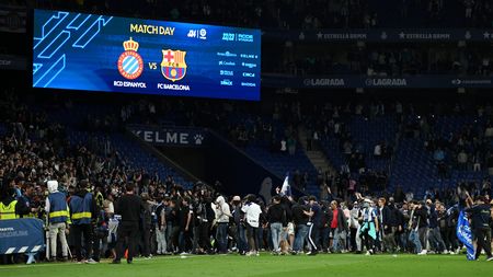 BARCELONA, SPAIN - MAY 14: Fans of RCD Espanyol are seen on the pitch after the LaLiga Santander match between RCD Espanyol and FC Barcelona at RCDE Stadium on May 14, 2023 in Barcelona, Spain. (Photo by David Ramos/Getty Images)