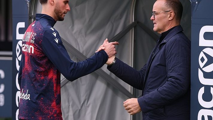 BOLOGNA, ITALY - MARCH 16: Oussama El Azzouzi of Bologna and Joey Saputo President of Bologna during the Serie A match between Bologna and SS Lazio at Stadio Renato Dall'Ara on March 16, 2025 in Bologna, Italy. (Photo by Alessandro Sabattini/Getty Images) El Azzouzi