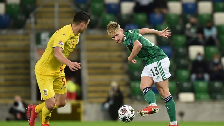 BELFAST, NORTHERN IRELAND - NOVEMBER 18: Alistair McCann of Northern Ireland shoots as Ionut Nedelcearu of Romania looks on during the UEFA Nations League group stage match between Northern Ireland and Romania at Windsor Park on November 18, 2020 in Belfast, Northern Ireland. A limited number of spectators (1060) will be in attendance as Covid-19 pandemic restrictions are eased in Northern Ireland. (Photo by Charles McQuillan/Getty Images) Euro 2024