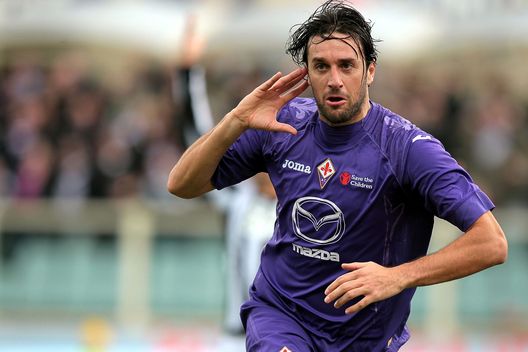 FLORENCE, ITALY - DECEMBER 16: Luca Toni of ACF Fiorentina celebrates after scoring the opening goal during the Serie A match between ACF Fiorentina and AC Siena at Stadio Artemio Franchi on December 16, 2012 in Florence, Italy. (Photo by Gabriele Maltinti/Getty Images)