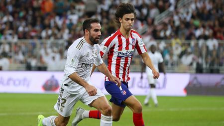 JEDDAH, SAUDI ARABIA - JANUARY 12: Daniel Carvajal of Real Madrid battles for possession with Joao Felix of Atletico Madrid during the Supercopa de Espana Final match between Real Madrid and Club Atletico de Madrid at King Abdullah Sports City on January 12, 2020 in Jeddah, Saudi Arabia. (Photo by Francois Nel/Getty Images)