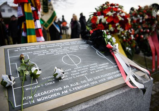MUNICH, GERMANY - FEBRUARY 06: Flowers lie on a memorial stone recalling the Munich air disaster of 6th February 1958, as 23 people including 8 members of the Manchester United football team lost their lives on February 6, 2018 in Munich, Germany. (Photo by Sebastian Widmann/Bongarts/Getty Images)