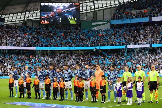 MANCHESTER, ENGLAND - MAY 17: Manchester City players line up on the pitch prior to the UEFA Champions League semi-final second leg match between Manchester City FC and Real Madrid at Etihad Stadium on May 17, 2023 in Manchester, England. (Photo by Clive Brunskill/Getty Images) Manchester City