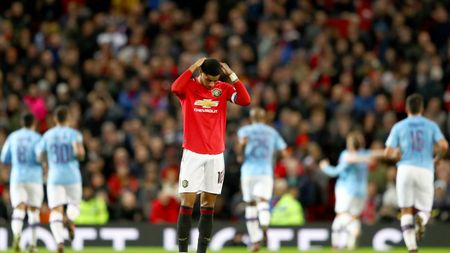 MANCHESTER, ENGLAND - JANUARY 07: Marcus Rashford of Manchester United reacts to Manchester City scoring there third goal during the Carabao Cup Semi Final match between Manchester United and Manchester City at Old Trafford on January 07, 2020 in Manchester, England. (Photo by Michael Steele/Getty Images)