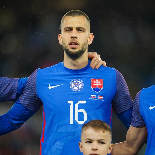 BRATISLAVA, SLOVAKIA - MARCH 23: David Hancko of Slovakia stands for the national anthem prior to the international friendly match between Slovakia and Austria at National Football stadium on March 23, 2024 in Bratislava, Slovakia. (Photo by Christian Hofer/Getty Images) Hancko