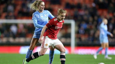 LEIGH, ENGLAND - NOVEMBER 17: Aoife Mannion of Manchester United holds off Laura Coombs of Manchester City during the FA Women's Continental Tyres League Cup match between Manchester United and Manchester City at Leigh Sports Village on November 17, 2021 in Leigh, England. (Photo by Charlotte Tattersall/Getty Images)