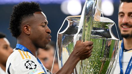 LONDON, ENGLAND - JUNE 01: Vinicius Junior of Real Madrid kisses the UEFA Champions League Trophy after his team's victory during the UEFA Champions League 2023/24 Final match between Borussia Dortmund and Real Madrid CF at Wembley Stadium on June 01, 2024 in London, England. (Photo by Justin Setterfield/Getty Images)