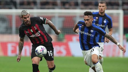 MILAN, ITALY - SEPTEMBER 03: Theo Hernandez of AC Milan is challenged by Lautaro Martinez of FC Internazionale during the Serie A match between AC Milan and FC Internazionale at Stadio Giuseppe Meazza on September 03, 2022 in Milan, Italy. (Photo by Emilio Andreoli - Inter/Inter via Getty Images)