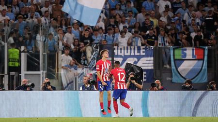 ROME, ITALY - SEPTEMBER 19: Pablo Barrios of Atletico Madrid celebrates with Samuel Lino of Atletico Madrid after scoring the team's first goal during the UEFA Champions League Group E match between SS Lazio and Atletico Madrid at Stadio Olimpico on September 19, 2023 in Rome, Italy. (Photo by Paolo Bruno/Getty Images)