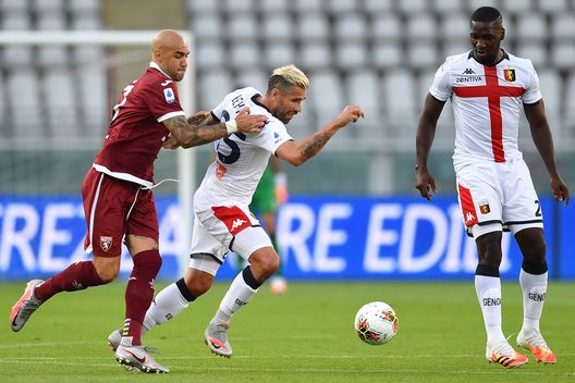 TURIN, ITALY - JULY 16: Simone Zaza (L) of Torino FC tackles Valon Behrami of Genoa CFC during the Serie A match between Torino FC and Genoa CFC at Stadio Olimpico di Torino on July 16, 2020 in Turin, Italy. (Photo by Valerio Pennicino/Getty Images)