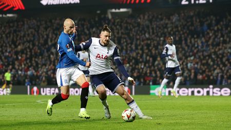 GLASGOW, SCOTLAND - DECEMBER 12: Vaclav Cerny of Rangers FC is challenged by Radu Dragusin of Tottenham Hotspur during the UEFA Europa League 2024/25 League Phase MD6 match between Rangers FC and Tottenham Hotspur at Ibrox Stadium on December 12, 2024 in Glasgow, Scotland. (Photo by Ian MacNicol/Getty Images) Radu Dragusin