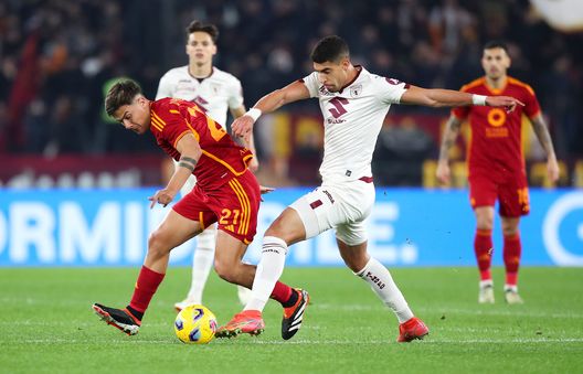ROME, ITALY - FEBRUARY 26: Paulo Dybala of AS Roma is challenged by Samuele Ricci of Torino FC during the Serie A TIM match between AS Roma and Torino FC at Stadio Olimpico on February 26, 2024 in Rome, Italy. (Photo by Paolo Bruno/Getty Images)