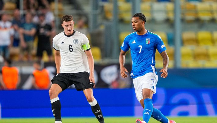 DUNAJSKA STREDA, SLOVAKIA - JUNE 22: Cher Ndour of U21 Italy passes the ball whilst under pressure from Eric Martel of U21 Germany during the UEFA European Under-21 Championship 2025 Quarter-Final match between Germany and Italy at DAC Arena on June 22, 2025 in Dunajska Streda, Slovakia. (Photo by Christian Hofer/Getty Images) Martel Ndour