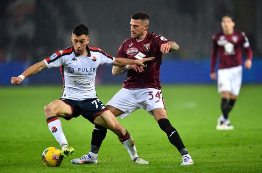 TURIN, ITALY - FEBRUARY 08: Patrizio Masini of Genoa is challenged by Cristiano Biraghi of Torino during the Serie A match between Torino and Genoa at Stadio Olimpico di Torino on February 08, 2025 in Turin, Italy. (Photo by Valerio Pennicino/Getty Images)