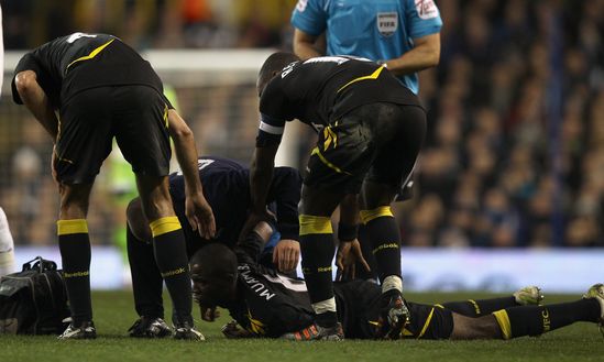 LONDON, ENGLAND - MARCH 17: Fabrice Muamba of Bolton Wanderers lies injured on the pitch during the FA Cup Sixth Round match between Tottenham Hotspur and Bolton Wanderers at White Hart Lane on March 17, 2012 in London, England. Fabrice Muamba suddenly collapsed and emergency services gave CPR treatment on the pitch, before taking him off on a stretcher, still unconscious. The match was abandoned. (Photo by Clive Rose/Getty Images)