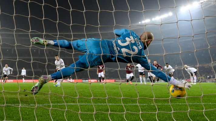 TURIN, ITALY - FEBRUARY 22: Vanja Milinkovic-Savic of Torino FC saves a penalty from Christian Pulisic of AC Milan during the Serie match between Torino and Milan at Stadio Olimpico di Torino on February 22, 2025 in Turin, Italy. (Photo by Claudio Villa/AC Milan via Getty Images) Maignan
