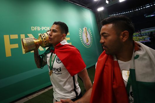 BERLIN, GERMANY - MAY 19: Carlos Salcedo of Frankfurt and Marco Fabian of Frankfurt walk out of the arena with the trophy after the DFB Cup final between Bayern Muenchen and Eintracht Frankfurt at Olympiastadion on May 19, 2018 in Berlin, Germany. (Photo by Maja Hitij/Bongarts/Getty Images)