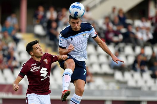 TURIN, ITALY - SEPTEMBER 23: Adam Marusic of SS Lazio competes for the ball with Josip Brekalo of Torino FC during the Serie A match between Torino FC v SS Lazio at Stadio Olimpico di Torino on September 23, 2021 in Turin, Italy. (Photo by Marco Rosi - SS Lazio/Getty Images)