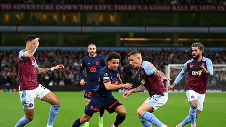 BIRMINGHAM, ENGLAND - APRIL 11: Tiago Santos of Lille runs with the ball whilst under pressure from Lucas Digne of Aston Villa during the UEFA Europa Conference League 2023/24 Quarter-final first leg match between Aston Villa and Lille OSC at Villa Park on April 11, 2024 in Birmingham, England. (Photo by Shaun Botterill/Getty Images)
