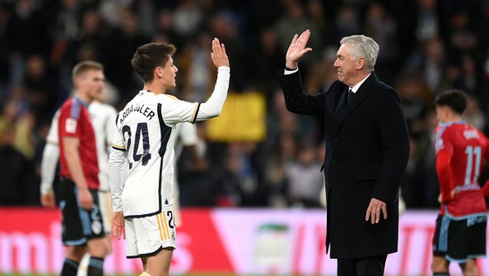 MADRID, SPAIN - MARCH 10: Arda Gueler of Real Madrid and Carlo Ancelotti, Head Coach of Real Madrid, celebrate at full-time following the team's victory in the LaLiga EA Sports match between Real Madrid CF and Celta Vigo at Estadio Santiago Bernabeu on March 10, 2024 in Madrid, Spain. (Photo by Denis Doyle/Getty Images) Arda Guler Ancelotti