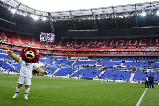 Lyon's new 'Grand Stade' stadium and the club's mascot are pictured prior to the French L1 football match between Olympique Lyonnais (OL) and Troyes on January 9, 2016 in Decines-Charpieu. AFP PHOTO / JEAN-PHILIPPE KSIAZEK / AFP / JEAN-PHILIPPE KSIAZEK (Photo credit should read JEAN-PHILIPPE KSIAZEK/AFP via Getty Images) Lione