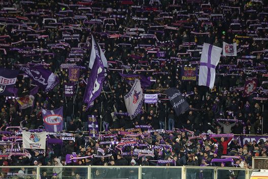 FLORENCE, ITALY - DECEMBER 23: Fans of ACF Fiorentina during the Serie A match between Fiorentina and Udinese at Stadio Artemio Franchi on December 23, 2024 in Florence, Italy. (Photo by Gabriele Maltinti/Getty Images) Curva Fiesole