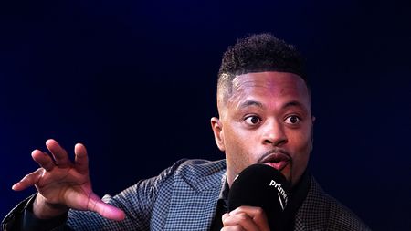 LONDON, ENGLAND - OCTOBER 12: Patrice Evra speaking with Gabby Logan on stage at the 'Prime Video Presents Sport' event at Pan Pacific on October 12, 2021 in London, England. At the event a series of announcements were revealed, including the Amazon Original documentary on the life and career of Wayne Rooney and Lioness: The Nicola Adams Story. (Photo by Tim P. Whitby/Getty Images for Amazon Prime) EVRA IN TV A OLD TRAFFORD