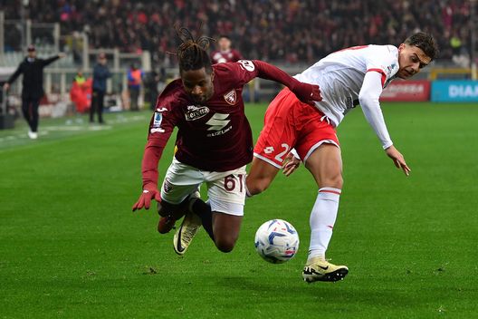 TURIN, ITALY - MARCH 30: Adrien Tameze of Torino FC is tackled by Daniel Maldini of AC Monza during the Serie A TIM match between Torino FC and AC Monza at Stadio Olimpico di Torino on March 30, 2024 in Turin, Italy. (Photo by Valerio Pennicino/Getty Images)