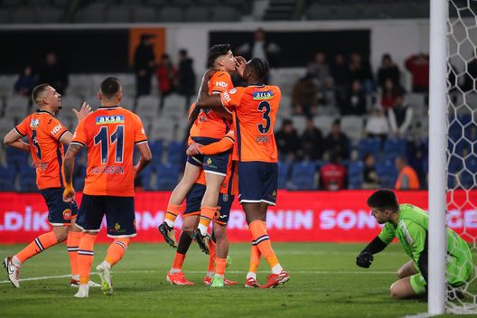 ISTANBUL, TURKEY - April 4: Emirhan Ilkhan (top) of Basaksehir celebrates after scoring his team's first goal during the Turkish Super League match between Basaksehir and Besiktas at Fatih Terim Stadium on April 4, 2024 in Istanbul, Turkey. (Photo by Ahmad Mora/Getty Images)