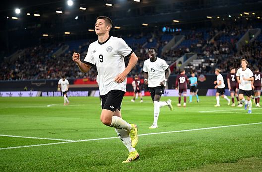 ROSTOCK, GERMANY - SEPTEMBER 09: Nicolo Tresoldi of Germany celebrates scoring his team's fourth goal to complete his hat-trick during the 2025 UEFA European Under-21 Championship Qualifier match between Germany U21 and Latvia U21 at Ostseestadion on September 09, 2025 in Rostock, Germany. (Photo by Stuart Franklin/Getty Images) bruges-nicolò-tresoldi-milan-nazionale