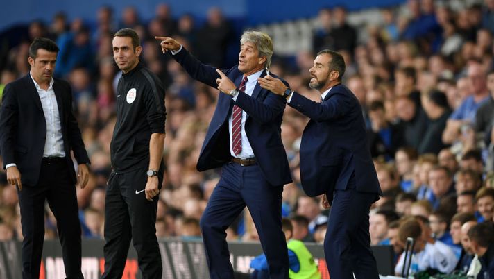 LIVERPOOL, ENGLAND - SEPTEMBER 16: Manuel Pellegrini, Manager of West Ham United, and West Ham United Assistant Coach, Enzo Maresca give their team instructions during the Premier League match between Everton FC and West Ham United at Goodison Park on September 16, 2018 in Liverpool, United Kingdom. (Photo by Stu Forster/Getty Images) pellegrini maresca