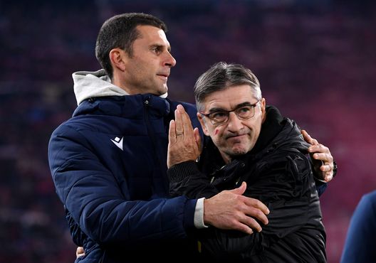 BOLOGNA, ITALY - NOVEMBER 27: Thiago Motta, Head Coach of Bologna FC, embraces Ivan Juric, Head Coach of Torino FC, as they wear a red mark on their faces in support of the #UNROSSOALLAVIOLENZA - the WeWorld Violence Against Women campaign prior to the Serie A TIM match between Bologna FC and Torino FC at Stadio Renato Dall'Ara on November 27, 2023 in Bologna, Italy. (Photo by Alessandro Sabattini/Getty Images)