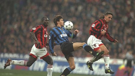24 Nov 1996: Massimo Paganin of Inter, with the ball, is challenged by Roberto Baggio of Milan (right) as George Weah of Milan (left) gives chase during the Serie A match between AC Milan and Inter Milan at the San Siro Stadium in Milan, Italy. Mandatory Credit: Claudio Villa/Allsport