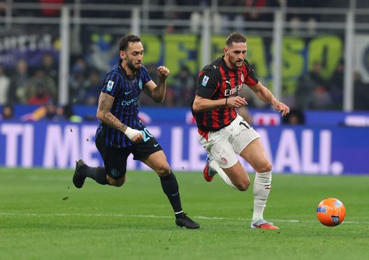 MILAN, ITALY - NOVEMBER 23: Adrien Rabiot of AC Milan competes for the ball with Hakan Calhanoglu of FC Internazionale during the Serie A match between FC Internazionale and AC Milan at Giuseppe Meazza Stadium on November 23, 2025 in Milan, Italy. (Photo by Claudio Villa/AC Milan via Getty Images) milan-inter-derby-rabiot-serie-a
