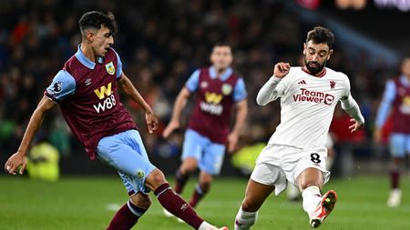 BURNLEY, ENGLAND - SEPTEMBER 23: Ameen Al-Dakhil of Burnley and Bruno Fernandes of Manchester United challenge during the Premier League match between Burnley and Manchester United at Turf Moor on September 23, 2023 in Burnley, England. (Photo by Will Palmer/Sportsphoto/Allstar via Getty Images)