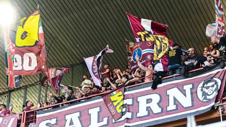 GENOA, ITALY - APRIL 16: Fans of Salernitana wave flags during the Serie A match between UC Sampdoria and US Salernitana at Stadio Luigi Ferraris on April 16, 2022 in Genoa, Italy. (Photo by Getty Images)