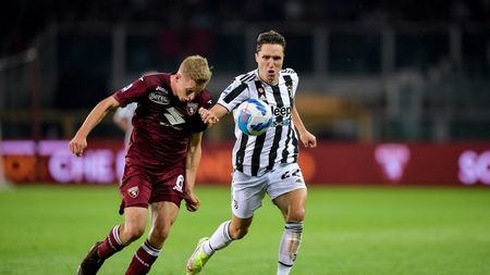 TURIN, ITALY - OCTOBER 02: Federico Chiesa of Juventus and Torino player David Zima during the Serie A match between Torino FC v Juventus at Stadio Olimpico di Torino on October 02, 2021 in Turin, Italy. (Photo by Daniele Badolato - Juventus FC/Juventus FC via Getty Images)