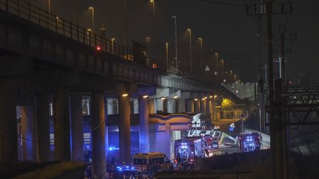 MESTRE, ITALY - OCTOBER 03: Emergency crew members work at the scene after a bus accident near Venice on October 03, 2023 in Mestre, Italy. A bus belonging to the transport company La Linea plunged from an overpass between Mestre and Marghera, plunging 10 meters and catching fire shortly before 8 p.m. At least 20 people are reported killed, including some minors, and many others injured. (Photo by Stefano Mazzola/Getty Images)