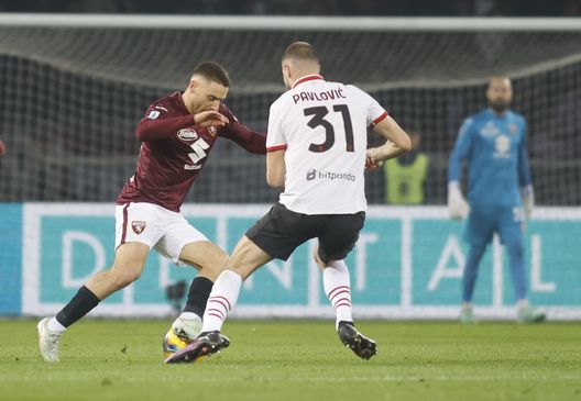 TURIN, ITALY - FEBRUARY 22: Nikola Vlasic of Torino FC controls the ball whilst under pressure from Strahinja Pavlovic of AC Milan during the Serie A match between Torino and AC Milan at Stadio Olimpico di Torino on February 22, 2025 in Turin, Italy. (Photo by Nderim Kaceli / Toro News) torino-milan