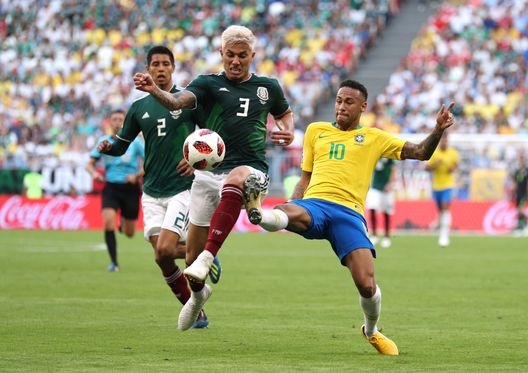 SAMARA, RUSSIA - JULY 02: Neymar Jr of Brazil challenge for the ball with Carlos Salcedo of Mexico during the 2018 FIFA World Cup Russia Round of 16 match between Brazil and Mexico at Samara Arena on July 2, 2018 in Samara, Russia. (Photo by Buda Mendes/Getty Images)