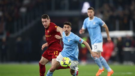 ROME, ITALY - MARCH 19: Andrea Belotti of AS Roma and Danilo Cataldi of SS Lazio battle for the ball during the Serie A match between SS Lazio and AS Roma at Stadio Olimpico on March 19, 2023 in Rome, Italy. (Photo by Paolo Bruno/Getty Images)