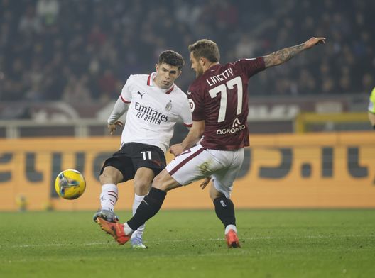 TURIN, ITALY - FEBRUARY 22: Karol Linetty of Torino battling for the ball with Christian Pulisic during the Serie A match between Torino and AC Milan at Stadio Olimpico di Torino on February 22, 2025 in Turin, Italy. (Photo by Nderim Kaceli / Toro News)