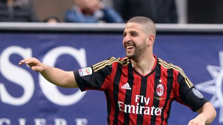 MILAN, ITALY - APRIL 19: Adel Taarabt of AC Milan (R) celebrates scoring the second goal during the Serie A match between AC Milan and AS Livorno Calcio at San Siro Stadium on April 19, 2014 in Milan, Italy. (Photo by Claudio Villa/Getty Images)