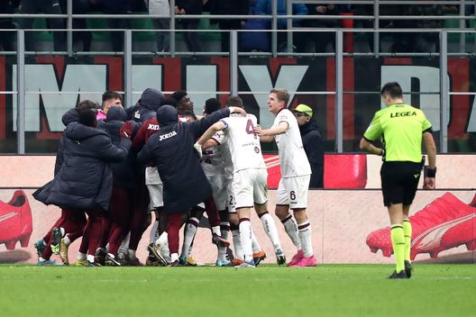 MILAN, ITALY - JANUARY 11: Michel Ndary Adopo of Torino FC celebrates with teammates after scoring the sides first goal during the Coppa Italia match between AC Milan and Torino FC at Stadio Giuseppe Meazza on January 11, 2023 in Milan, Italy. (Photo by Marco Luzzani/Getty Images)